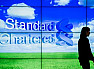 Stanchart reports 2012 income growth