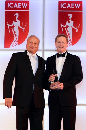 James Rigney (right), is presented with his ‘CFO of the Year’ award by Bassam Hage, EY’s Regional Managing Partner for Markets.
